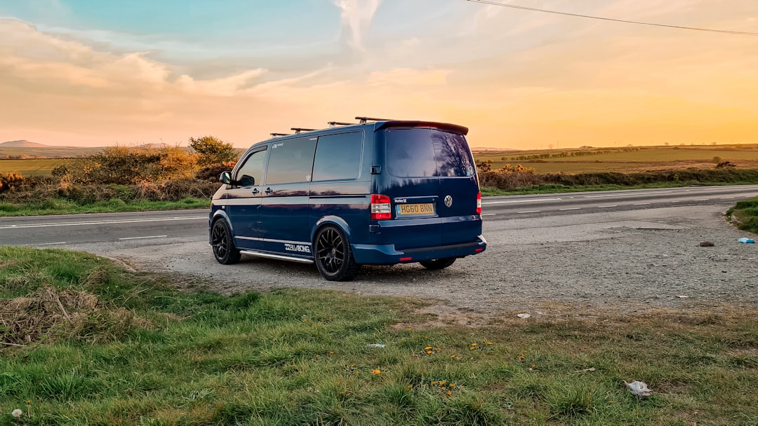 services-02 a-blue-van-parked-on-the-side-of-a-road-tsn4lugusjw